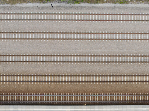 Aerial view of multiple parallel railway tracks forming a geometric rail transportation pattern