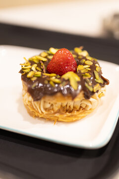 Gourmet Paris-Brest choux pastry filled with cream and fresh strawberries