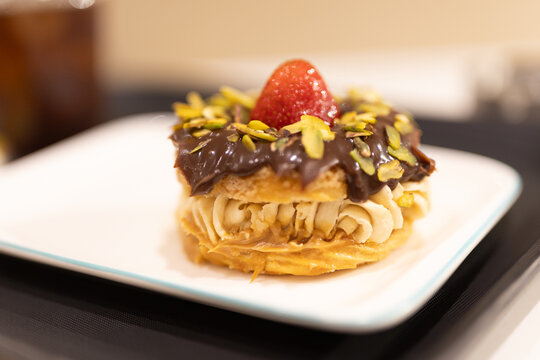 Gourmet Paris-Brest choux pastry filled with cream and fresh strawberries