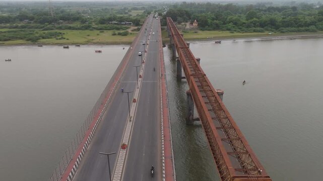 Aerial view of highway bridge and golden bridge crossing river in Bharuch, Gujarat, India
