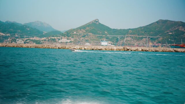 Embankments of the Salerno commercial port seen from a boat