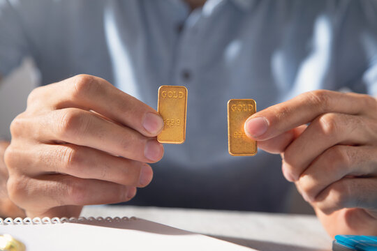 Man with a gold bar. Business. Investment