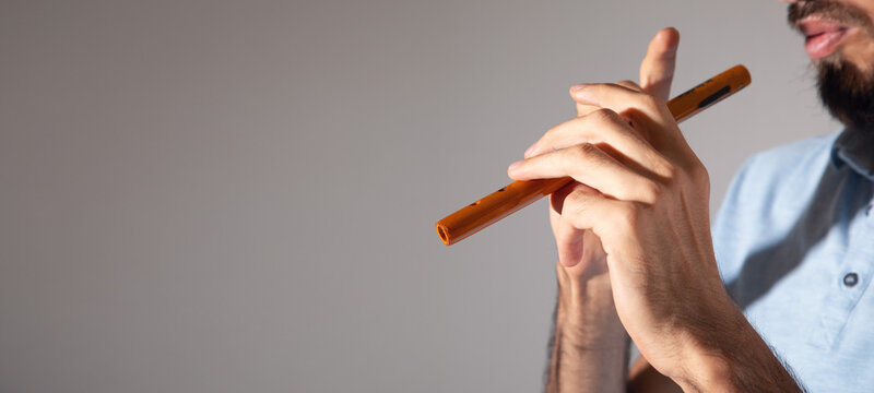 Caucasian man showing Armenian duduk.