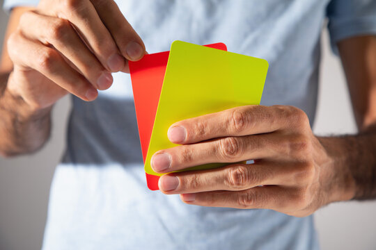 Man showing red and yellow cards.