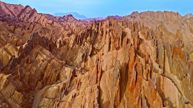 Aerial view of dramatic eroded sandstone peaks and ridges in the Red Mountain Stone Forest, Kuqa, Xinjiang, China