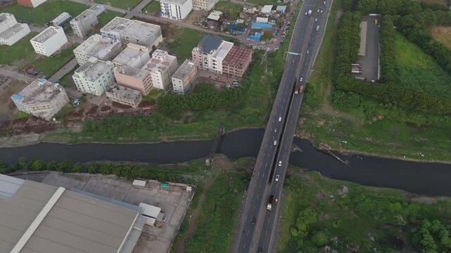 Aerial drone view of highway, bridge and residential buildings in Bharuch, Gujarat, India
