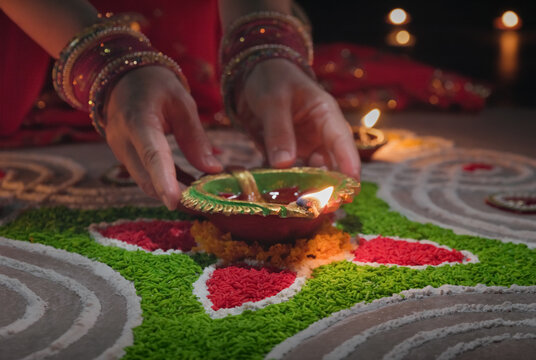 Clay diya lamps lit during diwali celebration, Diwali, or Deepavali, is India's biggest and most important holiday.