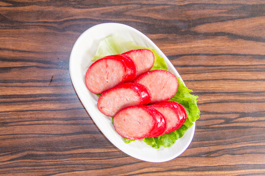 Freshly sliced meat served on a bed of lettuce showcasing a popular dish