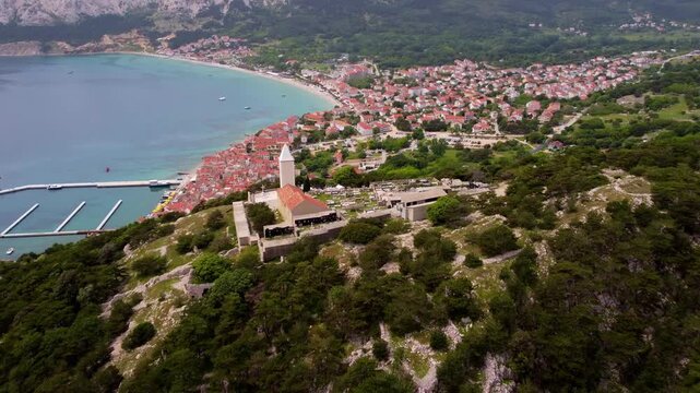 Aerial Pullback from Church of St. John Revealing Ba&scaron;ka Bay and Adriatic Sea, Krk Island, Croatia