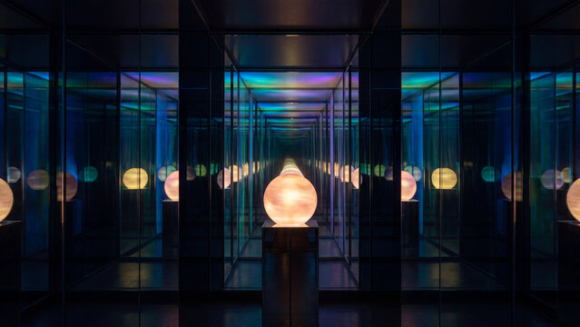 Glowing spherical lamp reflects infinitely inside a dark mirror maze with colorful neon lights.