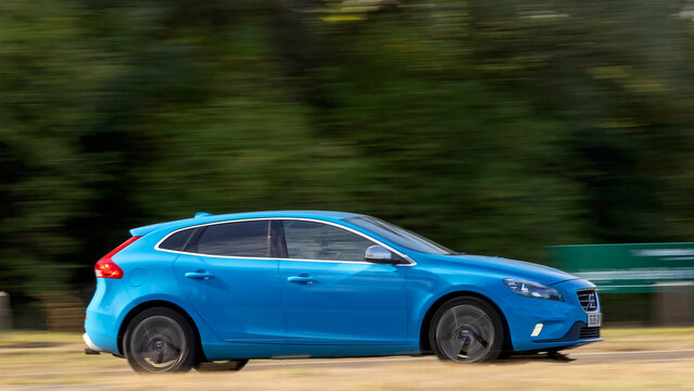 Milton Keynes; UK - Sept. 6th 2026:  2016 blue Volvo V40 car driving on a British road