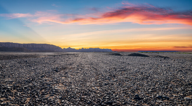 Scenic sunset light shining over vast yardang landforms and desert landscapes in Dahaidao, Gobi Desert, Xinjiang, China