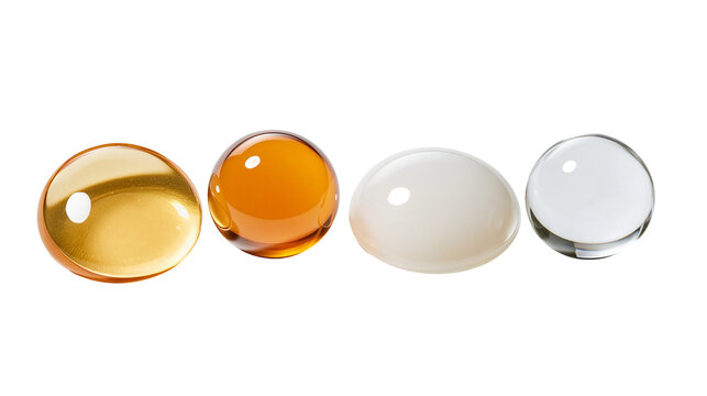Four smooth spherical glass and resin cabochons in yellow orange white and clear