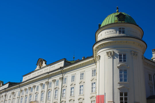Detail of the majestic facade of the Hofburg Imperial Palace under a clear blue summer sky. Innsbruck, Tyrol, Austria, Europe