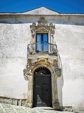 Impressive travel photograph showcasing ornate Sicilian Baroque architecture on a historic street in Erice, ideal for Italian culture guides and architectural media.