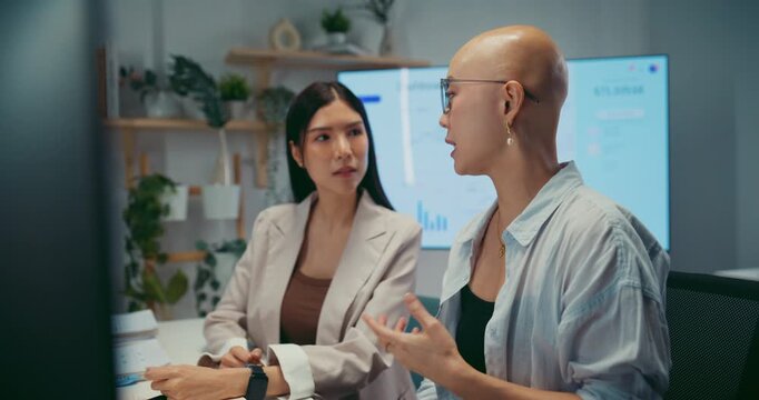 Young Asian business colleagues discussing project on computer at office. Corporate teamwork meeting, marketing report analysis, strategy planning development, professional manager advice concept.
