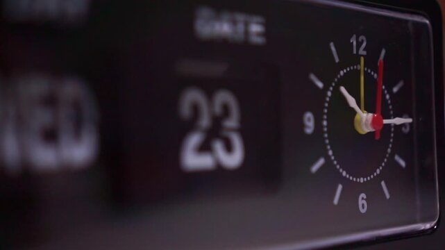 Vintage desk clock showing analog hands close up, retro flip display, nostalgic time passage concept.