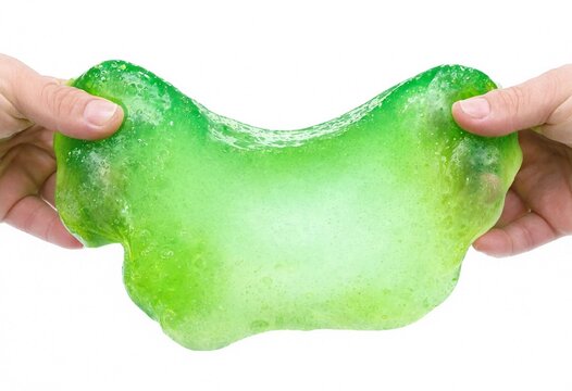 Hands stretching a bright green translucent slime toy against a white background