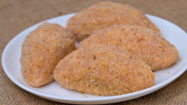 video of a breaded cordon bleu schnitzel filled with melted cheese