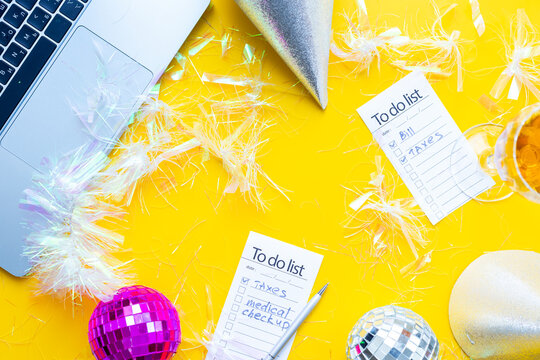 Work with fun. Laptop and to do lists with confetti and disco balls. Admin night party concept
