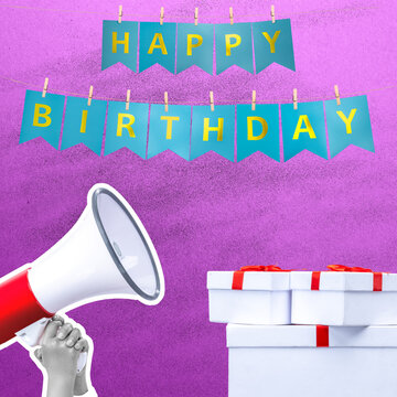 Happy Birthday banner hanging above a hand holding a megaphone and a stack of wrapped presents against a purple background, conceptual party announcement and celebration theme. Happy birthday message