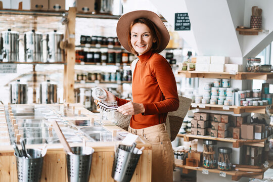 Woman buying products in plastic free grocery store