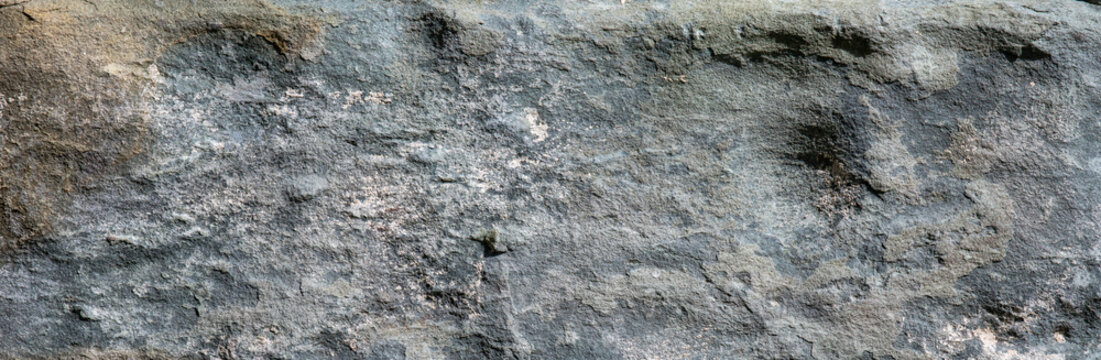 Rough natural grey stone rock surface texture background