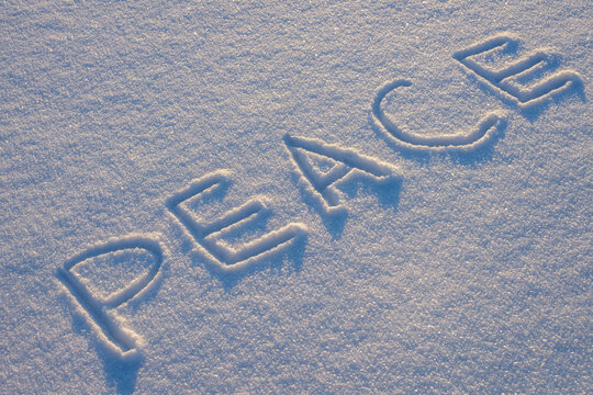 Words carved in snow convey peace and calm during winter season