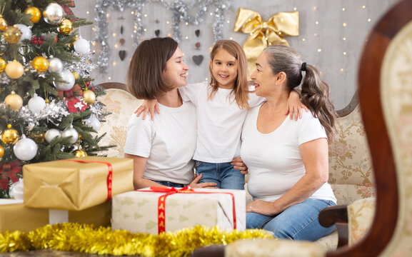 mother and grandmother are celebrating New Year's at home with the little daughter.