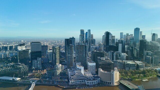 Melbourne CBD, Victoria, Australia &ndash; 4K aerial drone view of modern city skyline, Yarra River, Docklands marina, luxury yachts, skyscrapers and waterfront architecture at golden sunset hour