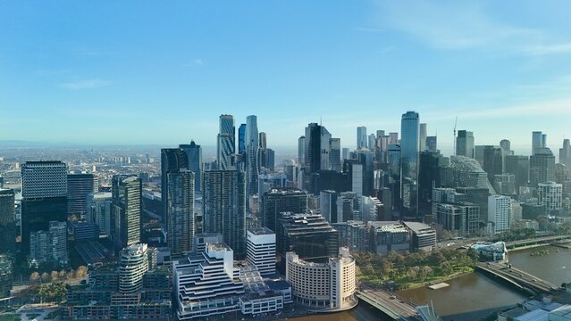 Melbourne CBD, Victoria, Australia &ndash; 4K aerial drone view of modern city skyline, Yarra River, Docklands marina, luxury yachts, skyscrapers and waterfront architecture at golden sunset hour