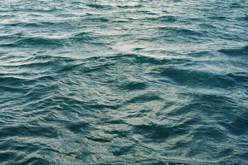 Fototapeta premium Turquoise Ocean Surface Showing Detailed Wave Patterns and Texture