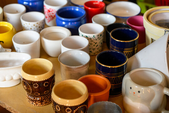 Vintage Ceramic Mugs and shown clearly in the frame in an outdoor setting, in a clean visual environment, under daylight, with a natural mood, suitable for marketing, editorial.