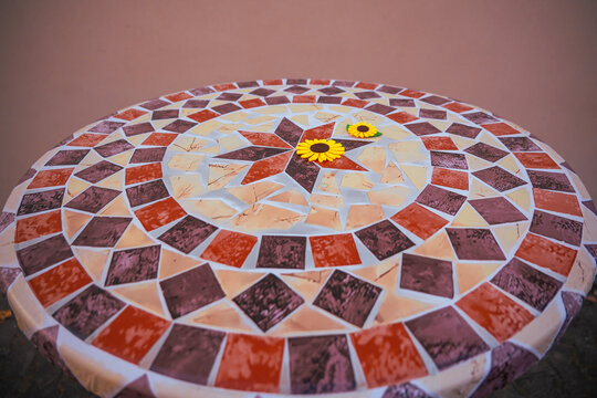 Vintage Mosaic Tabletop with shown clearly in the frame in an outdoor setting, in a clean visual environment, under daylight, with a natural mood, suitable for marketing, editorial.