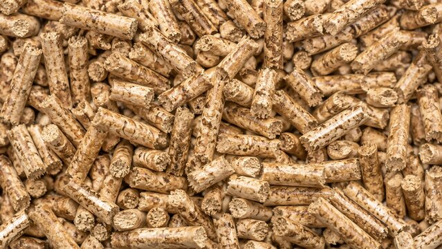 Compressed wood pellets texture. Renewable biomass fuel pellets for heating and stove energy