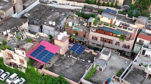 Aerial 4K View of Rooftop Solar Panels Across Residential Buildings in India, Showcasing Rapid Solar Energy Adoption and Renewable Energy Growth
