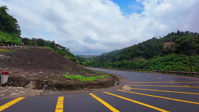 Car window view of driving through a scenic switchback road in Vietnam mountains