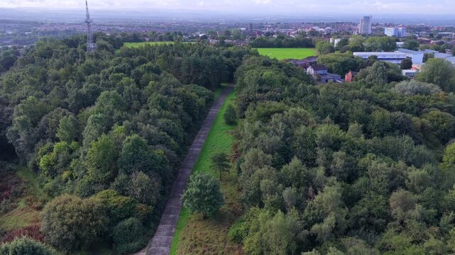 Aerial Video of Oldham Edge Ridge Path Woodland Canopy and Transmitting Station in Greater Manchester. 