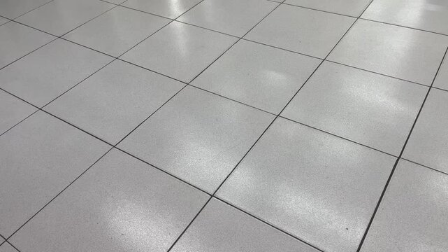 High angle shot of modern gray ceramic floor tiles grid