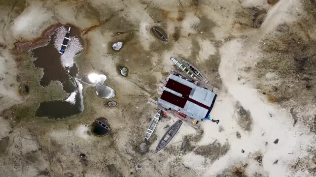 Aerial view of boats stranded in a dry lake as a result of extreme drought and climate change.