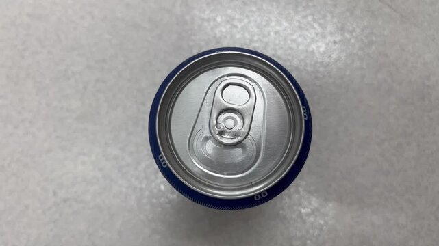 Top down view of beverage can with isolated blue rim