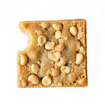 Blondie brownie nut square with a bite mark isolated on a transparent background for snack advertising