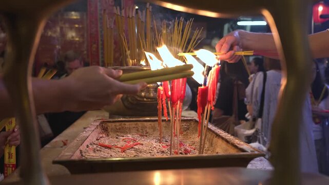 A Man Mo temple, or Man Mo Miu. People light candles and incense, recite prayers, bring offerings, and ask the gods for help.