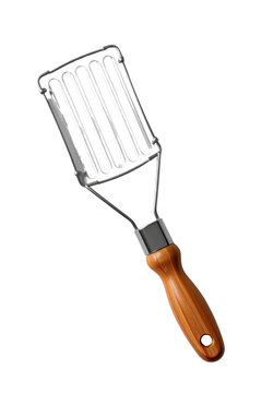 A metal spatula with a wooden handle, designed for flipping and lifting food during cooking or grilling.