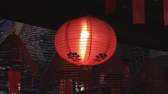 A Man Mo temple, or Man Mo Miu. People light candles and incense, recite prayers, bring offerings, and ask the gods for help.