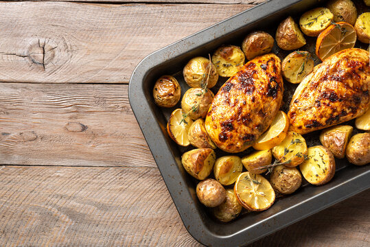 Oven roasted lemon garlic chicken and baby potatoes with herbs