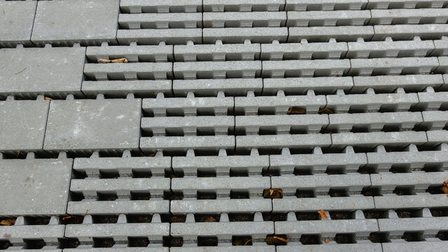 Stacked Gray Interlocking Concrete Paving Blocks from Above