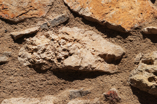 limestone rock fragments soil texture background gray beige rough surface natural terrain closeup pattern concept of nature, geology, background