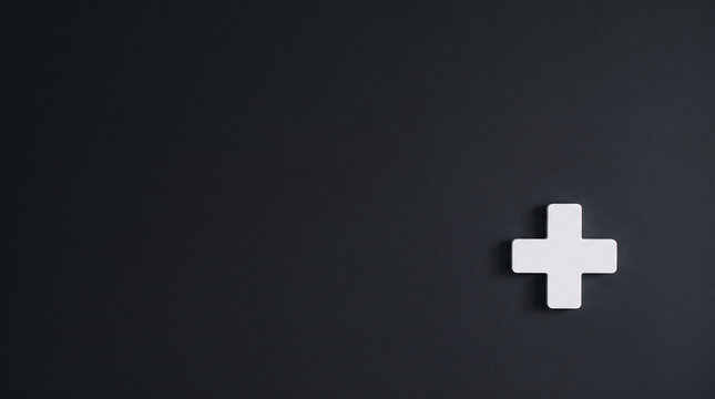 A solitary white cross or plus symbol prominently displayed against a stark dark background, conveying themes of positivity, growth, medical aid, or new solutions