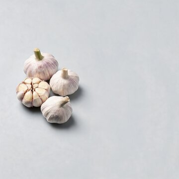 Fresh garlic bulbs on a clean neutral background